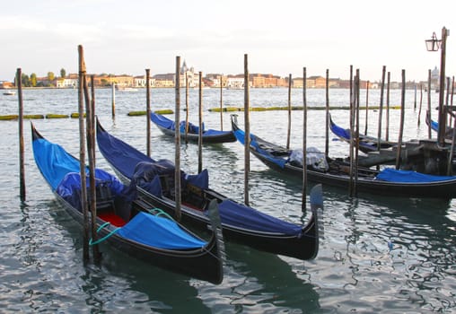 An HDR photo of moored gondolas in Venice, Italy.