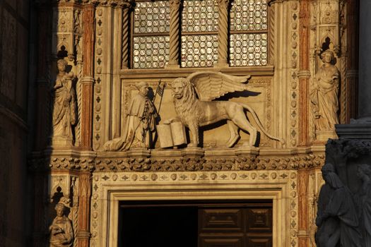 The Porta della Carta, entrance to St. Mark's basilica in Venice, Italy.  The apostle Mark's traditional symbol is the winged Lion.