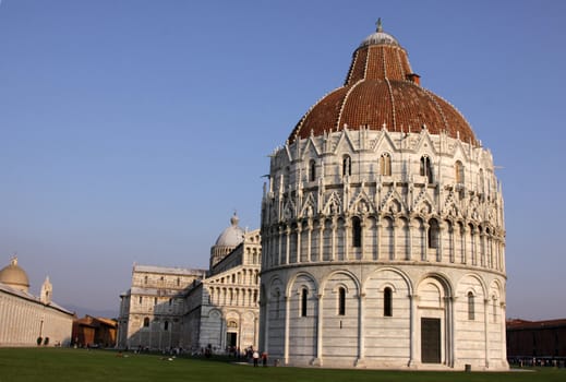 The Baptistry and cathedral in the Piazza del Duomo, in Pisa, Tuscany, Italy.
