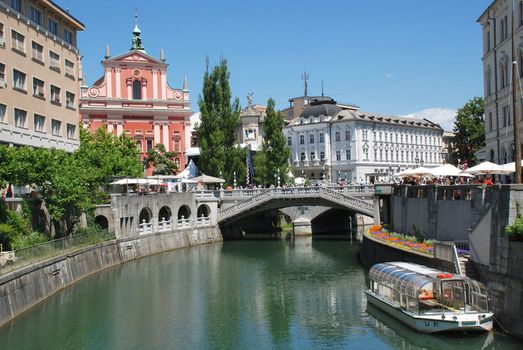 Tromostovje Ljublianica river and Church at Ljubljana - Slovenia