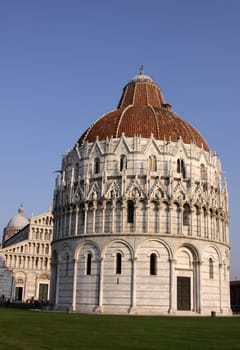 The Baptistry and cathedral in the Piazza del Duomo, in Pisa, Tuscany, Italy.
