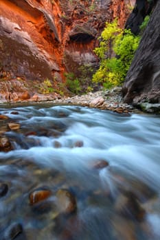 Smooth cascades of the Virgin River flow through The Narrows of Zion Canyon in Utah.
