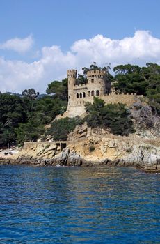 Landscape with castle view from sea in Lloret de Mar, Costa Brava, Spain.