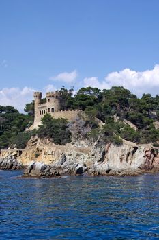 Landscape with castle view from sea in Lloret de Mar, Costa Brava, Spain. 