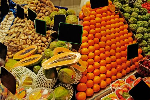 La Boqueria rows of fruits. World famous Barcelona market, Spain.