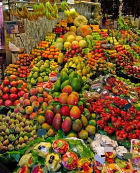 La Boqueria fruits stall. World famous Barcelona market, Spain.