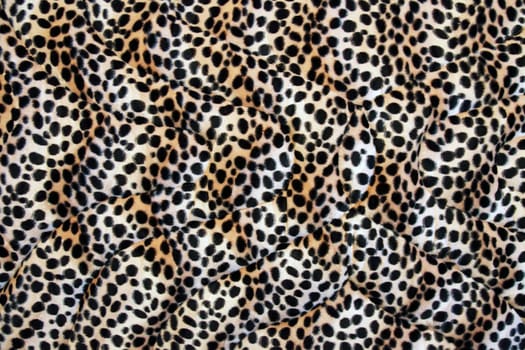 Abstract fabric made leopard cloth as background.