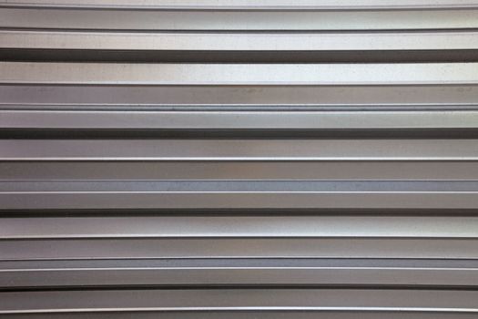 Abstract lined aluminium wall as backdrop or background.