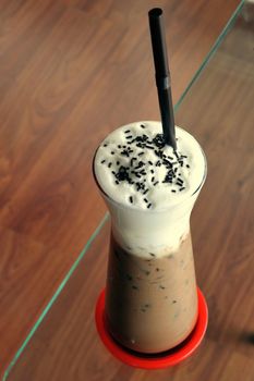 Cold fresh ice coffee with chocolate closeup.