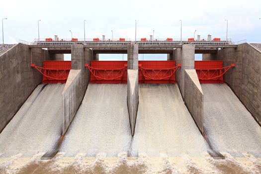 Water pouring through the water gates at dam