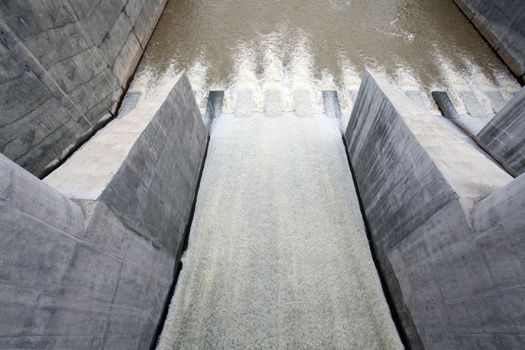 Water pouring through the water gates at dam