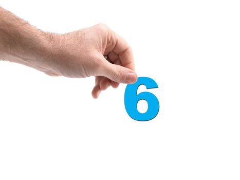 Numbers held by a hand isolated against a white background