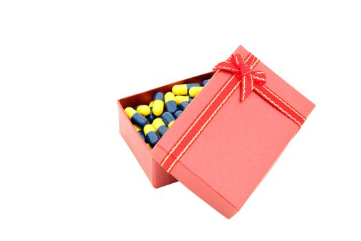 conceptual of capsule in red gift box