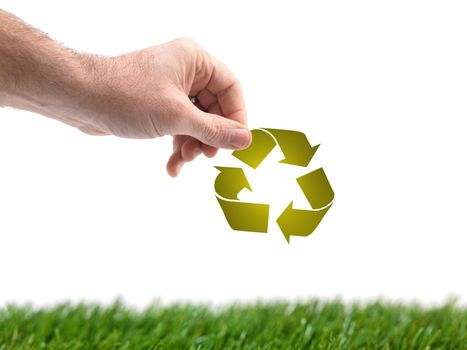 A conceptual recycle image held by a hand