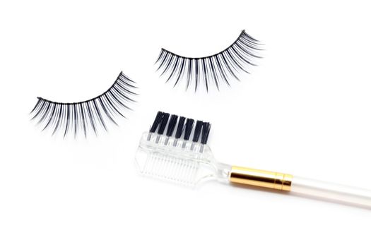 False eyelash mascara and make-up brush isolated on white 