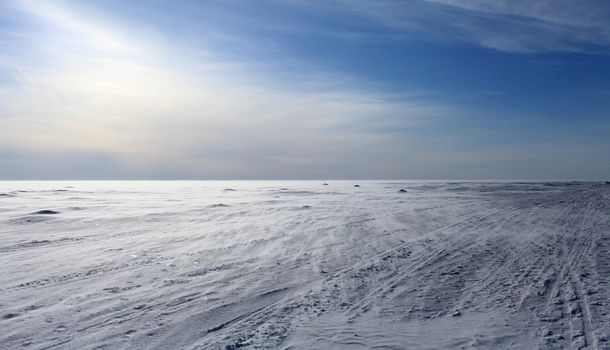 wind  frozen sea looking like white snowy desert