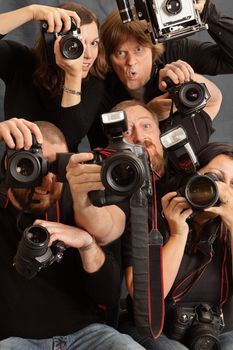Photo of paparazzi fighting for space to take photos.