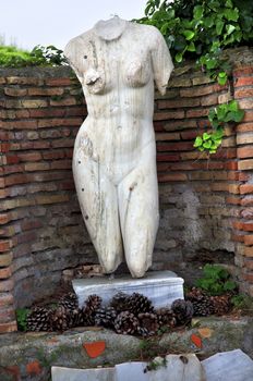 Ancient Roman NUde Woman Statue Ostia Antica Ruins Rome Italy
Excavation of Ostia, ancient Roman port, next to airport.  Was port for Rome until 5th Century AD.