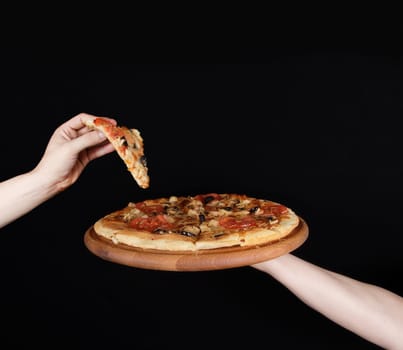 pizza plate on the human hand