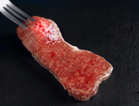 raw meat isolated on a black background