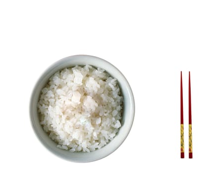 Chopsticks on a white bowl against a white tablecloth