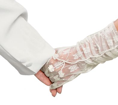 Just married couple holding hands on white
