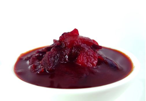 Red soup isolated on a white background