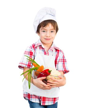 smiling boy with vegetables isolated in studio
