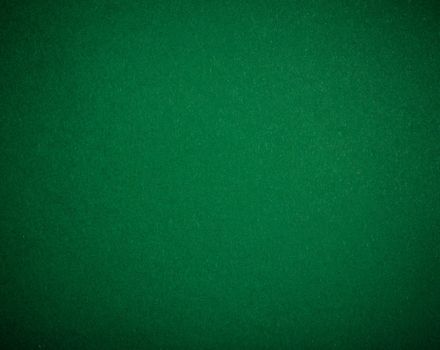 Poker table felt background in green color