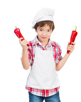 smiling boy with red peppers on a white background