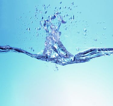 Water splash isolated on a blue background