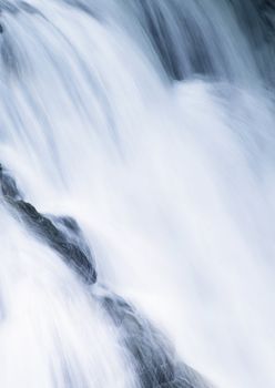 water cascade streaming down a lasher close up