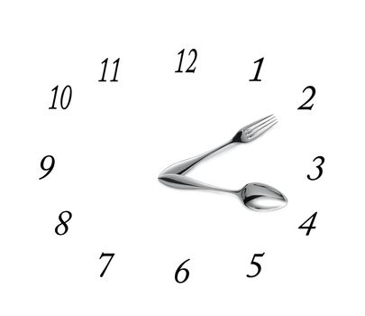Clock made of spoon and fork isolated