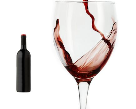 Red wine pouring down into a wine glass