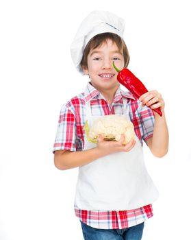 smiling boy with red pepper and cauliflower