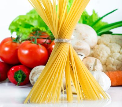 raw pasta with fresh vegetables