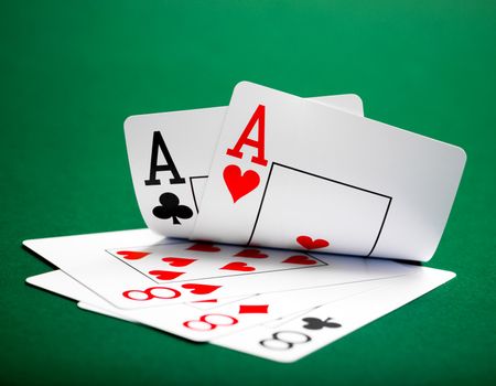 playing cards on a green table casino
