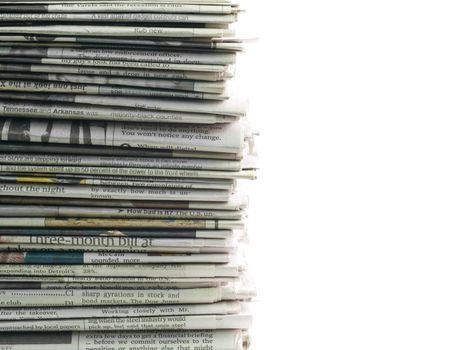 Old newspapers stacked from the top to bottom of the frame isolated on white