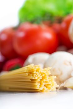 fresh colorful vegetables with raw pasta