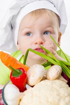 cute boy with vegetables closeup