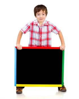 Smiling boy holding a blackboard over white background