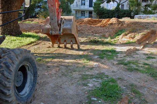 Industrial digger excavator machine at construction site.