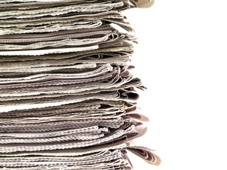 Old newspapers stacked from the top to bottom of the frame isolated on white