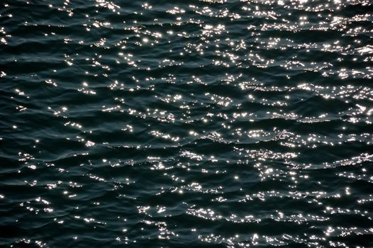 Light reflections on sea water. Abstract background.