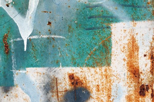 Messy paint stains on rusty metal. Grungy background texture.