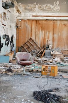 Abandoned vinyl records pressing factory. Dusty reel audio tape on the floor.