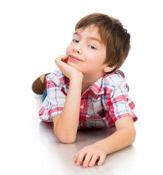 cute boy lying on white floor