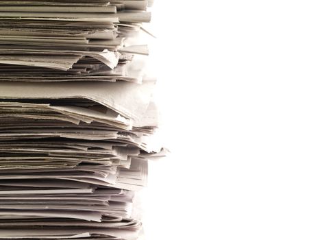 Old newspapers stacked from the top to bottom of the frame isolated on white