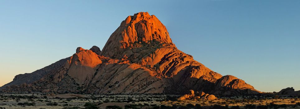 Panorama from three photos of the Spitzkoppe in Namibia at sunset