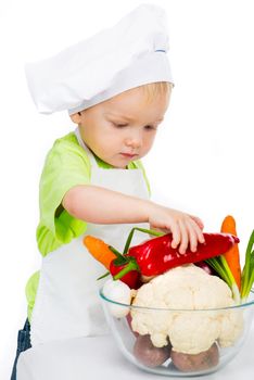 boy with vegetables isolated on a white background